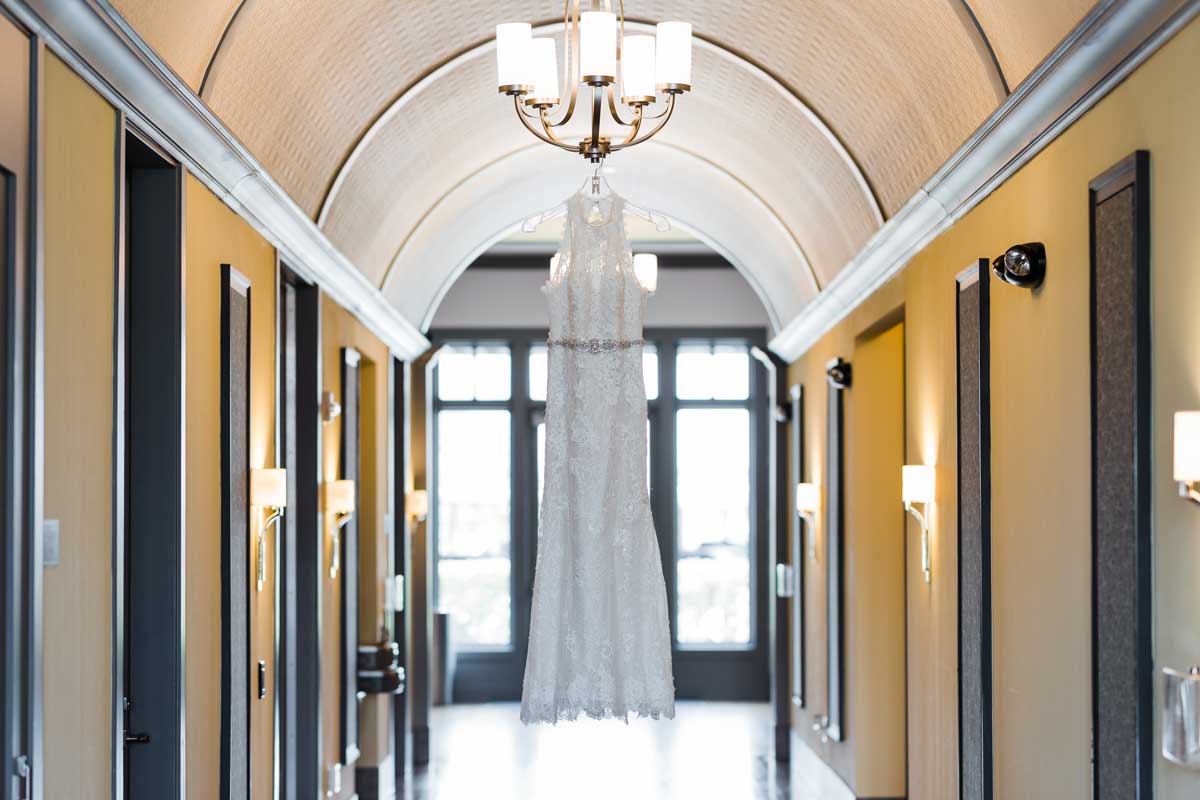 photo of a wedding dress hanging in a hall at The Ark in Katy