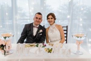 photo of bride and groom seated at designed table