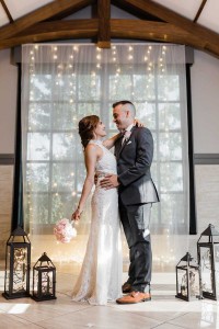 Newlyweds posed in elegant hall at The Ark in Katy