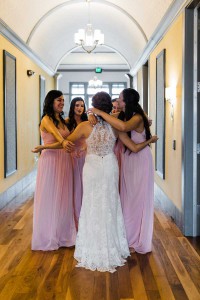 photo of the bride talking with bridesmaids