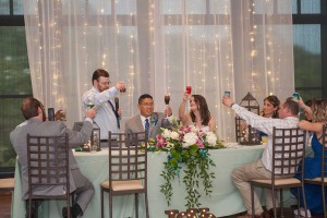 photo of the bride and groom toast at The Ark in Katy