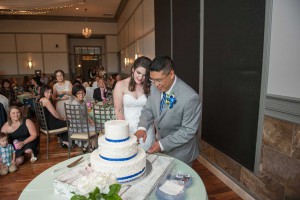 The bride and groom share cake at The Ark in Katy