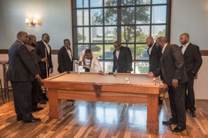 photo of groom and groomsmen playing pool at The Ark in Katy